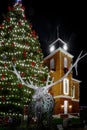 BREVARDÃ¯Â¼ÅNORTH CAROLINAÃ¯Â¼Å USA- DECEMBER 15Ã¯Â¼Å2020: The statue of an elk stands guard over the historic courthouse and decorated